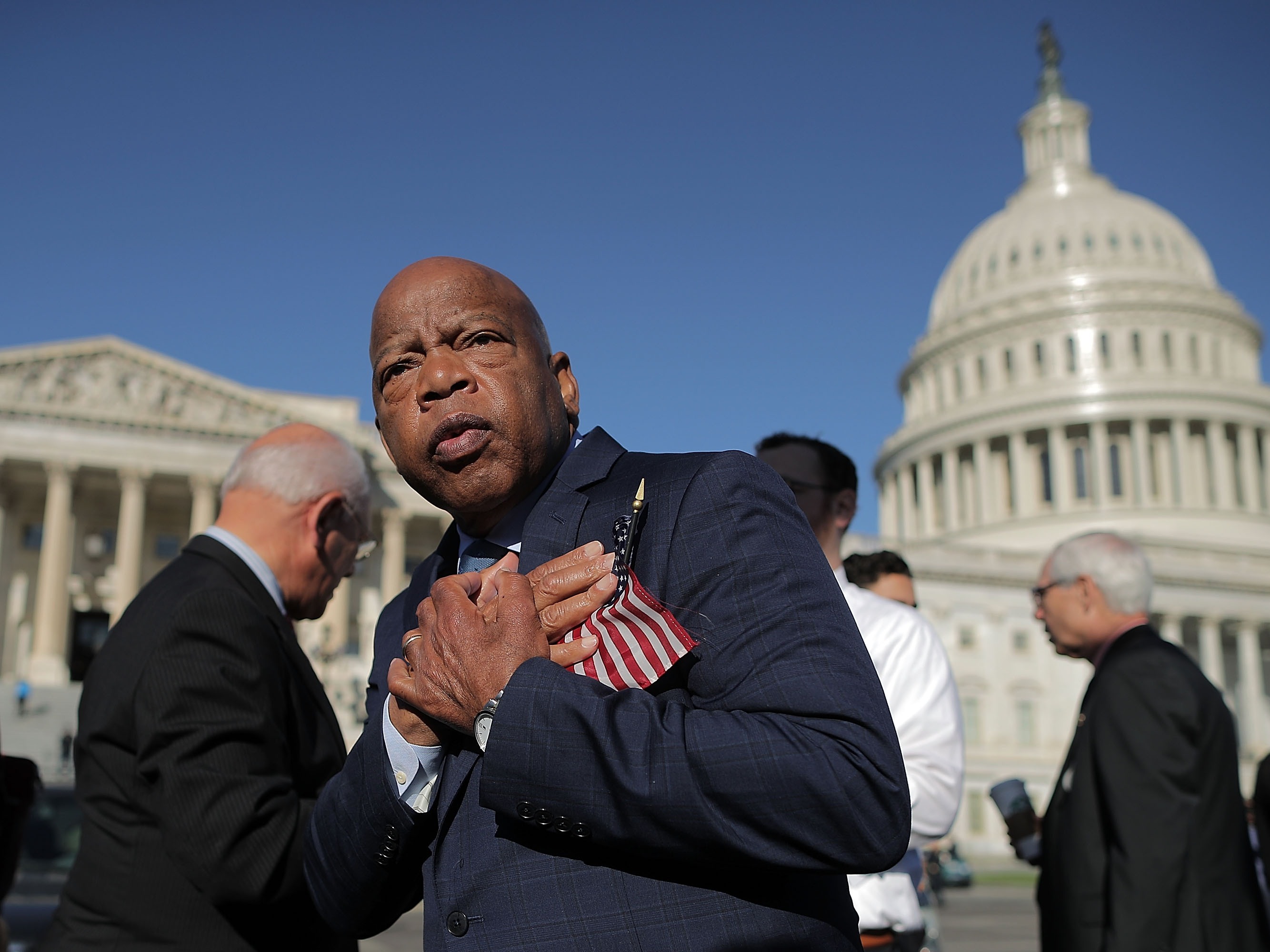 caption: Rep. John Lewis thanks anti-gun violence supporters following a rally outside the U.S. Capitol on Oct. 4, 2017.