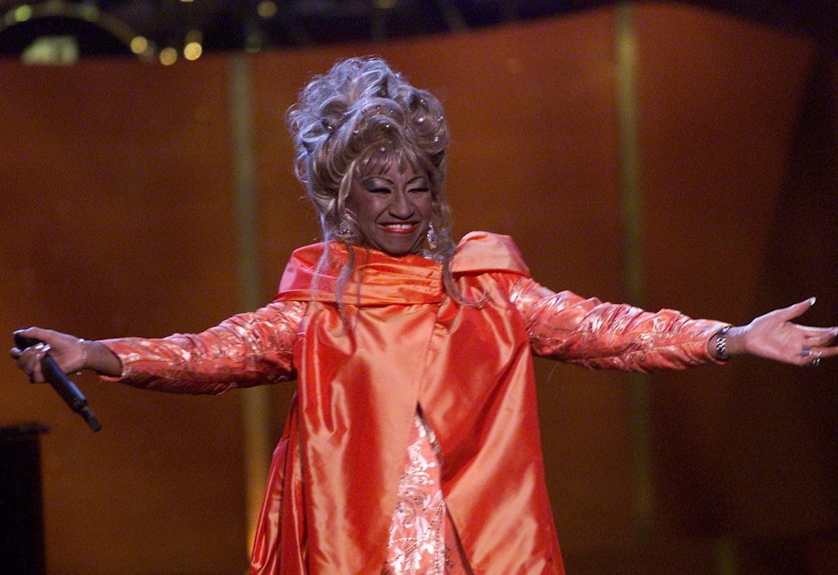 caption: Cuban American salsa singer Celia Cruz onstage performing at <em>VH1 Divas Live: The One and Only Aretha Franklin</em> in New York City in 2001. Cruz is being honored on the U.S. quarter in 2024.