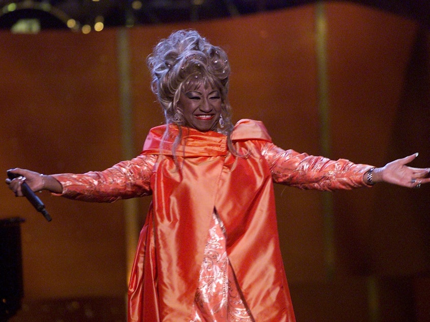caption: Cuban American salsa singer Celia Cruz onstage performing at <em>VH1 Divas Live: The One and Only Aretha Franklin</em> in New York City in 2001. Cruz is being honored on the U.S. quarter in 2024.