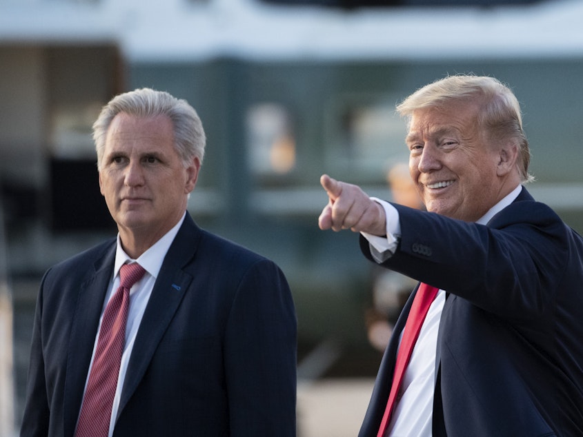 caption: Republicans often present a united front, but loyalty to former President Donald Trump, seen here with House GOP Leader Kevin McCarthy, and views about his future in the party are showing some divisions.