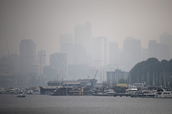 caption: Downtown Seattle is barely visible from Fremont on Monday, August 20, 2018, in Seattle, when heavy smoke from wildfires returned to the area. 