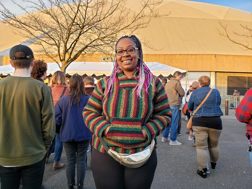 caption: 18-year-old Mataya Harris from Lakewood said she's still deciding who she'll support in this Democratic primary outside the Tacoma Dome on Monday, February 17th, 2020. 