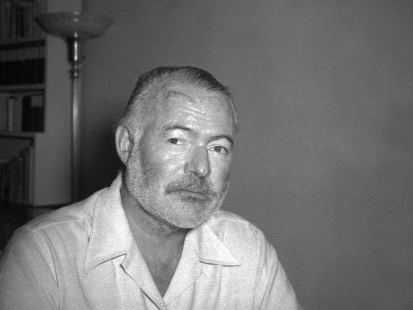 caption: Ernest Hemingway, novelist, is seen at his country home in San Francisco de Paula near Havana, Cuba on Aug. 21, 1950.
