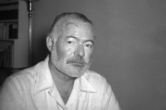 caption: Ernest Hemingway, novelist, is seen at his country home in San Francisco de Paula near Havana, Cuba on Aug. 21, 1950.