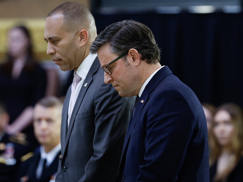 caption: House Democratic Leader Hakeem Jeffries and Speaker of the House Mike Johnson are seen here attending a congressional tribute in the rotunda of the U.S. Capitol for retired Army Col. Ralph Puckett Jr. on April 29.
