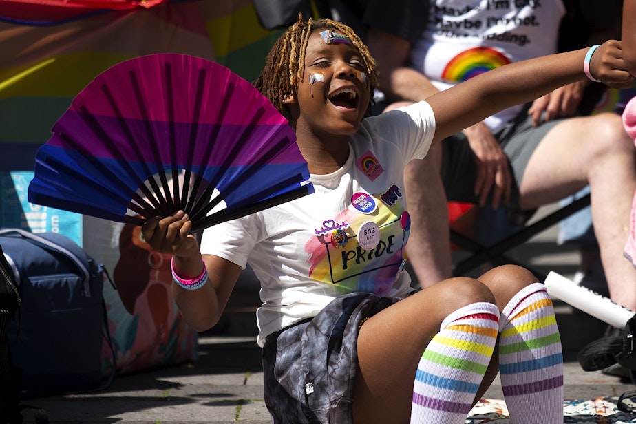 caption: Amirah Robinson, 12, cheers during Seattle’s Pride Parade on Sunday, June 25, 2023, in downtown Seattle. 