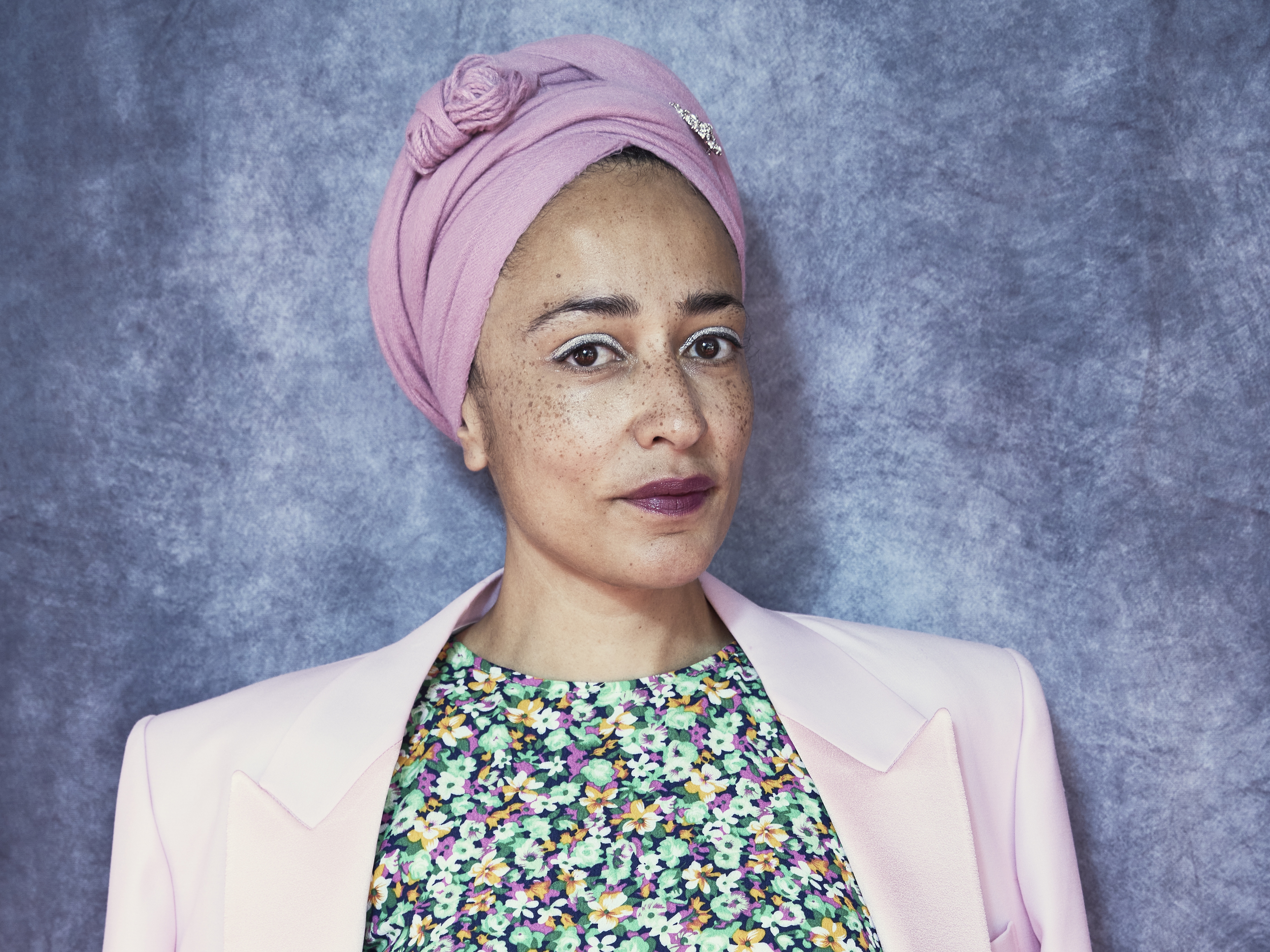 caption: "The one thing that I know now that I didn't know at 20 is that you become 50 in the blink of an eye," Zadie Smith says. Her new book of essays is called <em>Dead and Alive. </em>Smith is pictured above at the Rome Film Festival in 2021.