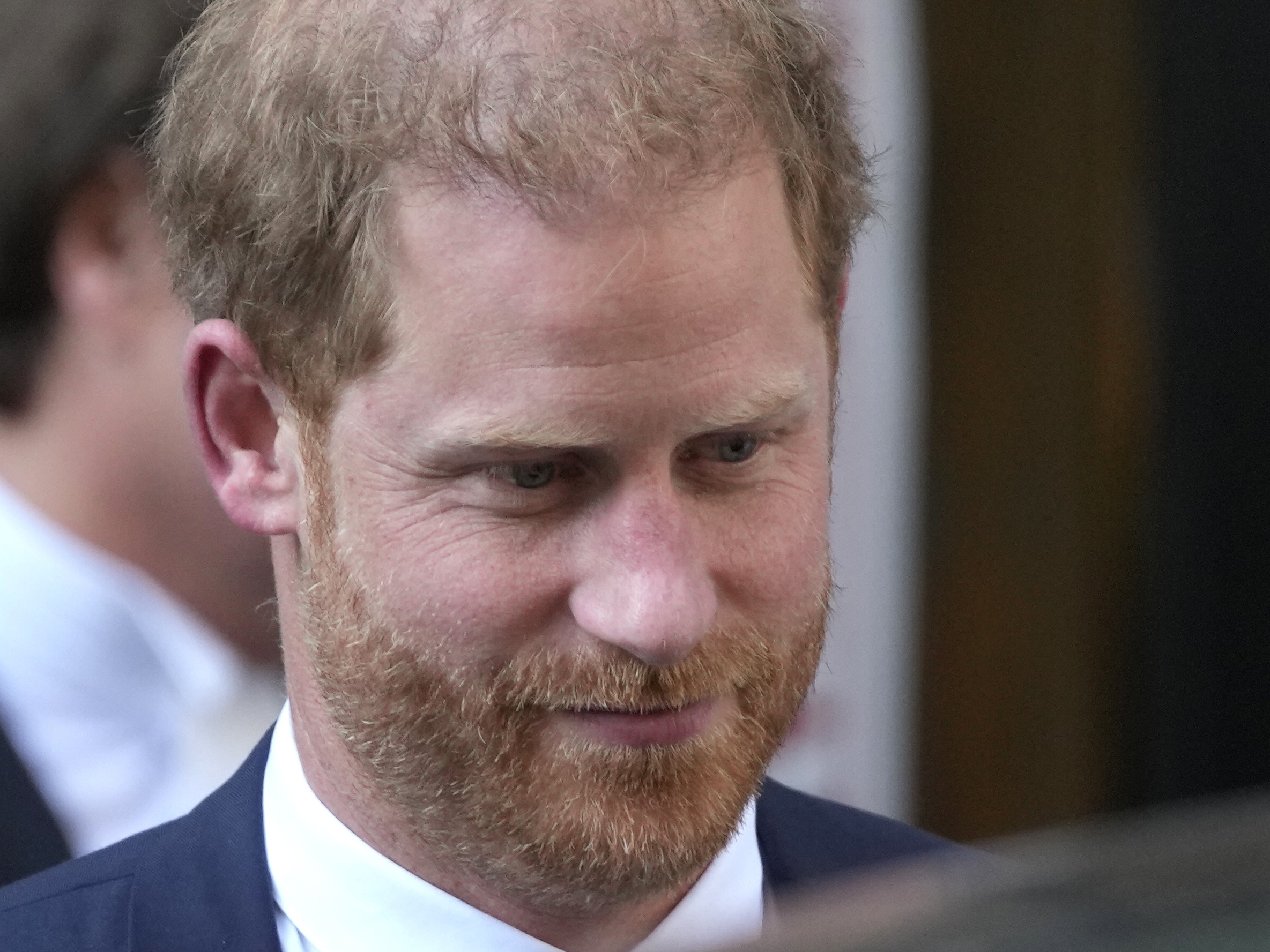 caption: Prince Harry pursued a legal case against Rupert Murdoch's British tabloids for years, saying he wanted to hold them accountable for invasions of privacy.