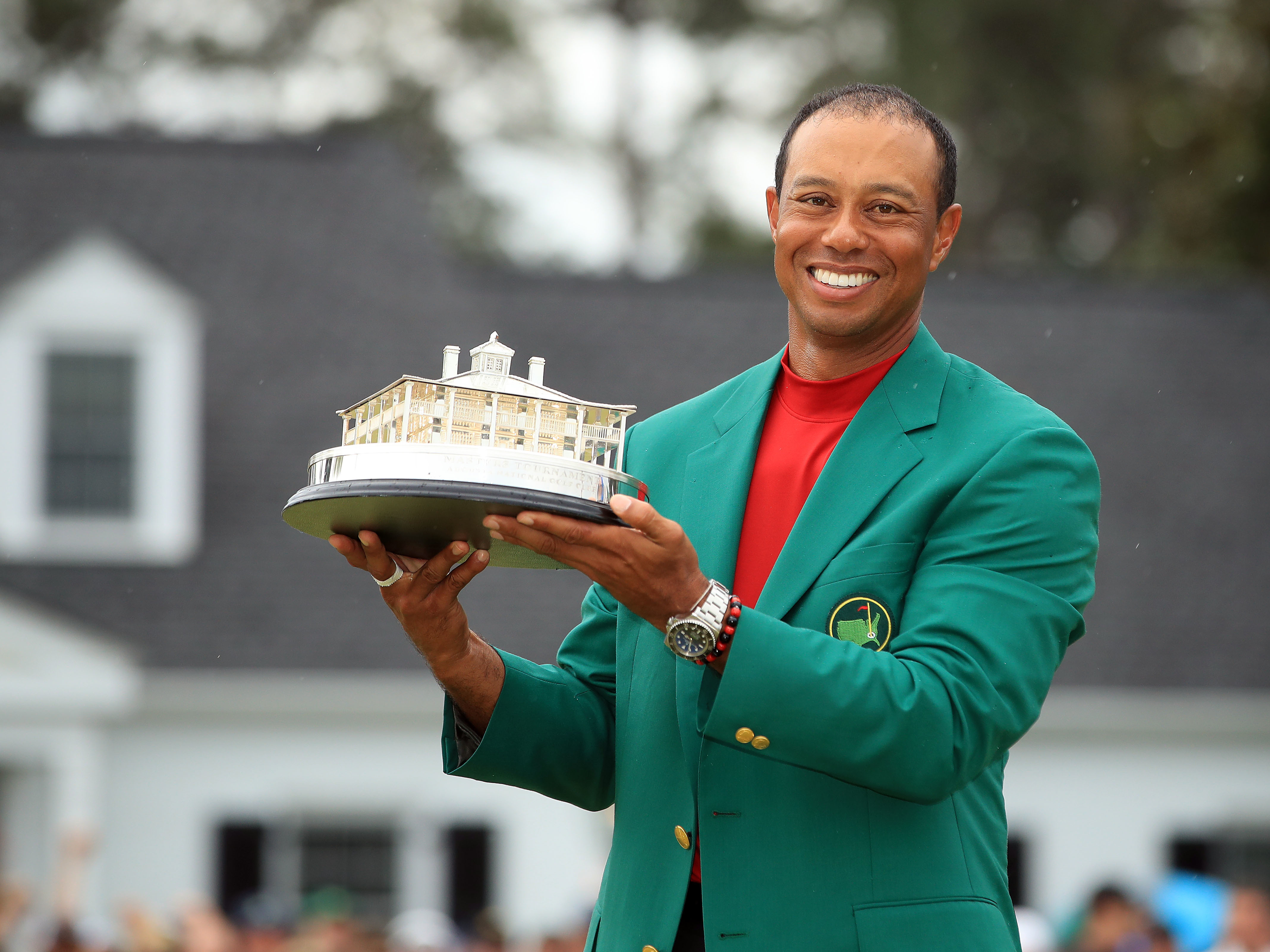 caption: Tiger Woods with the Masters trophy after winning the Masters at Augusta National Golf Club on April 14, 2019 in Augusta, Ga.
