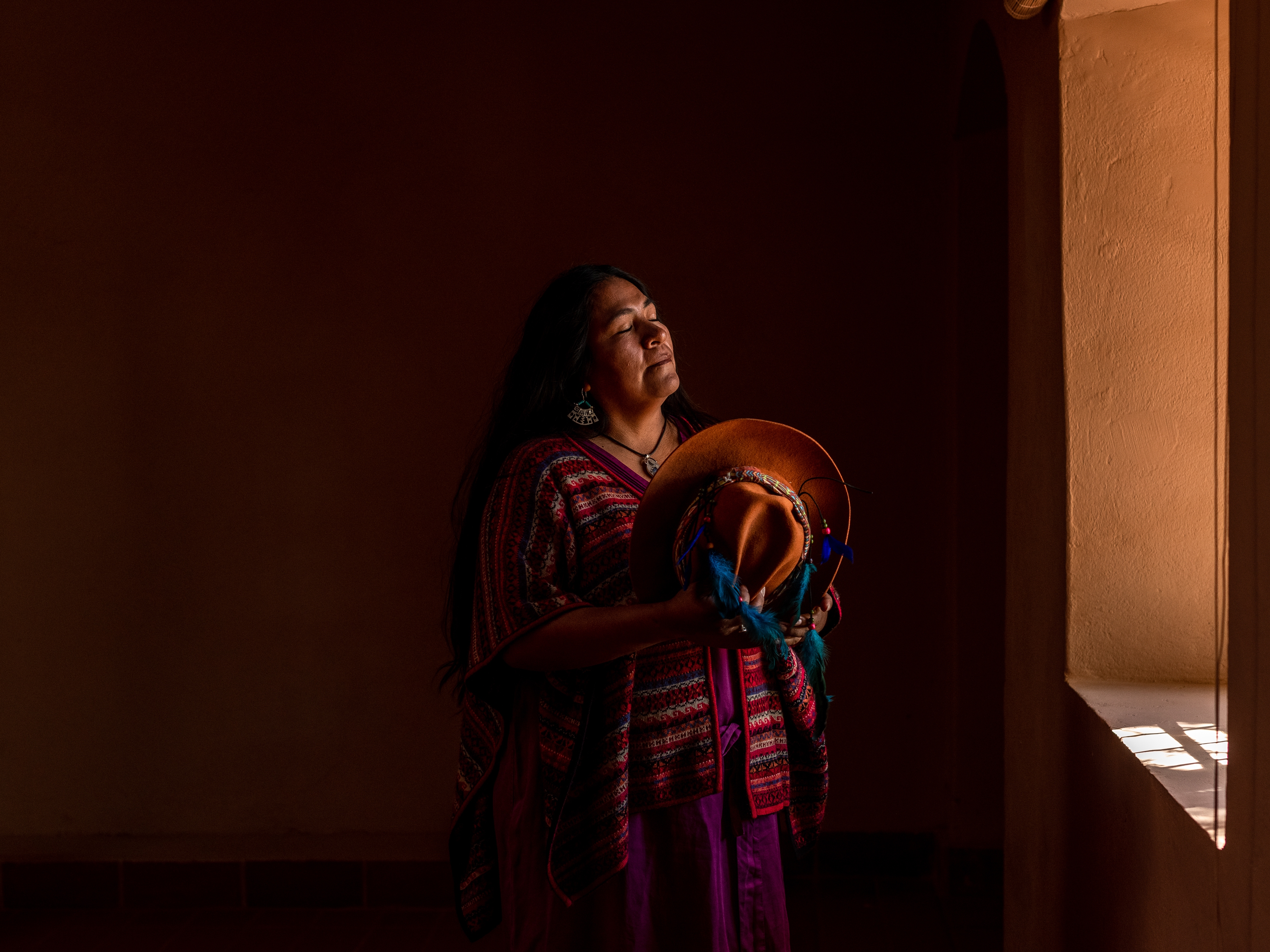 caption: Ilia Reyes Aymani, Kunza researcher and teacher in her home in San Pedro de Atacama, Chile.