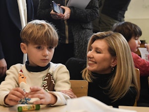 caption: Ukraine's First Lady Olena Zelenska heads the country's mental health campaign, called How Are You? She says the country is still overcoming the legacy of the Soviet era, when the government sometimes said dissidents had 'psychiatric problems' and locked them in mental institutions. She's shown here meeting with students in Paris last December.