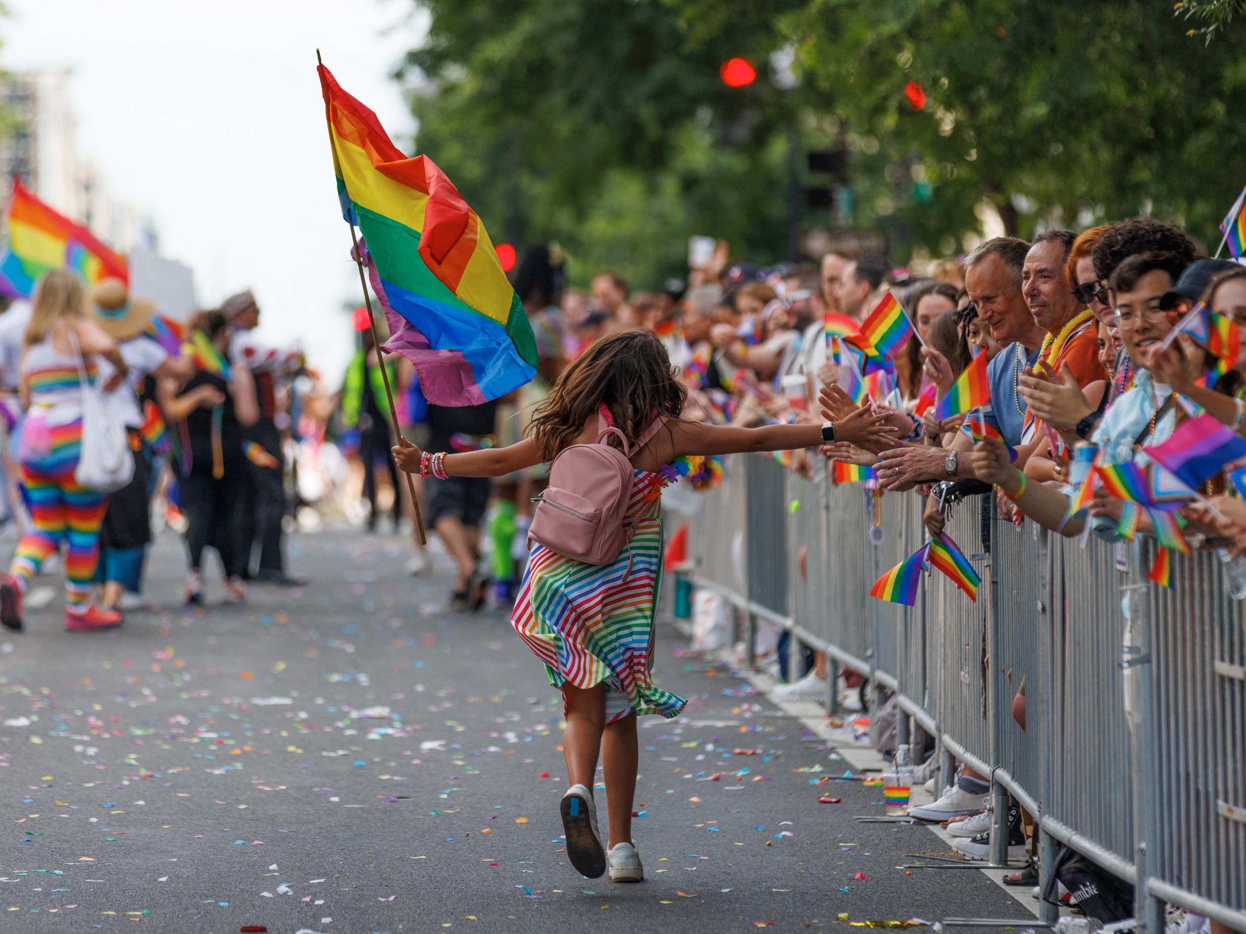 caption: Participants march through the DC Pride Parade on Saturday, June 8, 2024 in Washington, District of Columbia in Logan Circle.