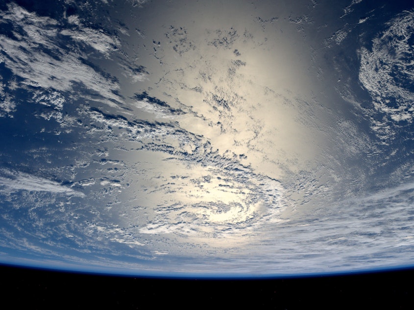 caption: German ESA astronaut Alexander Gerst took this image of the Earth reflecting light from the sun while aboard the International Space Station July 17, 2014.