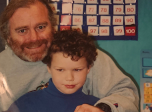 caption: Martin McGowan, left, a former teacher at West Woodland Elementary School in northwest Seattle, pictured here with first-grader Roman Harto in 2003.