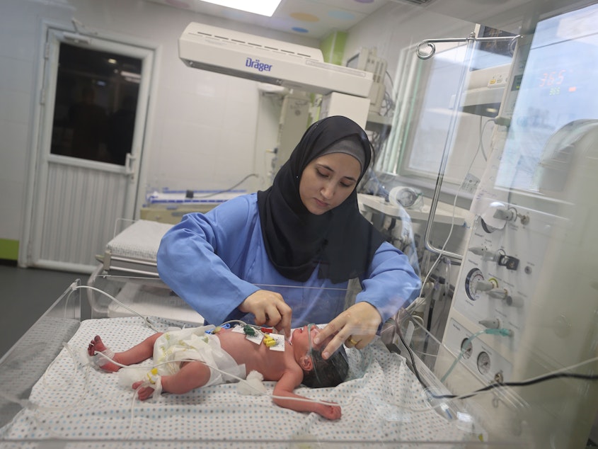 caption: This newborn at Gaza's Nasser Hospital was delivered after their mother was killed in an Israeli airstrike on Oct. 24. The doctor said the baby is now in stable condition.