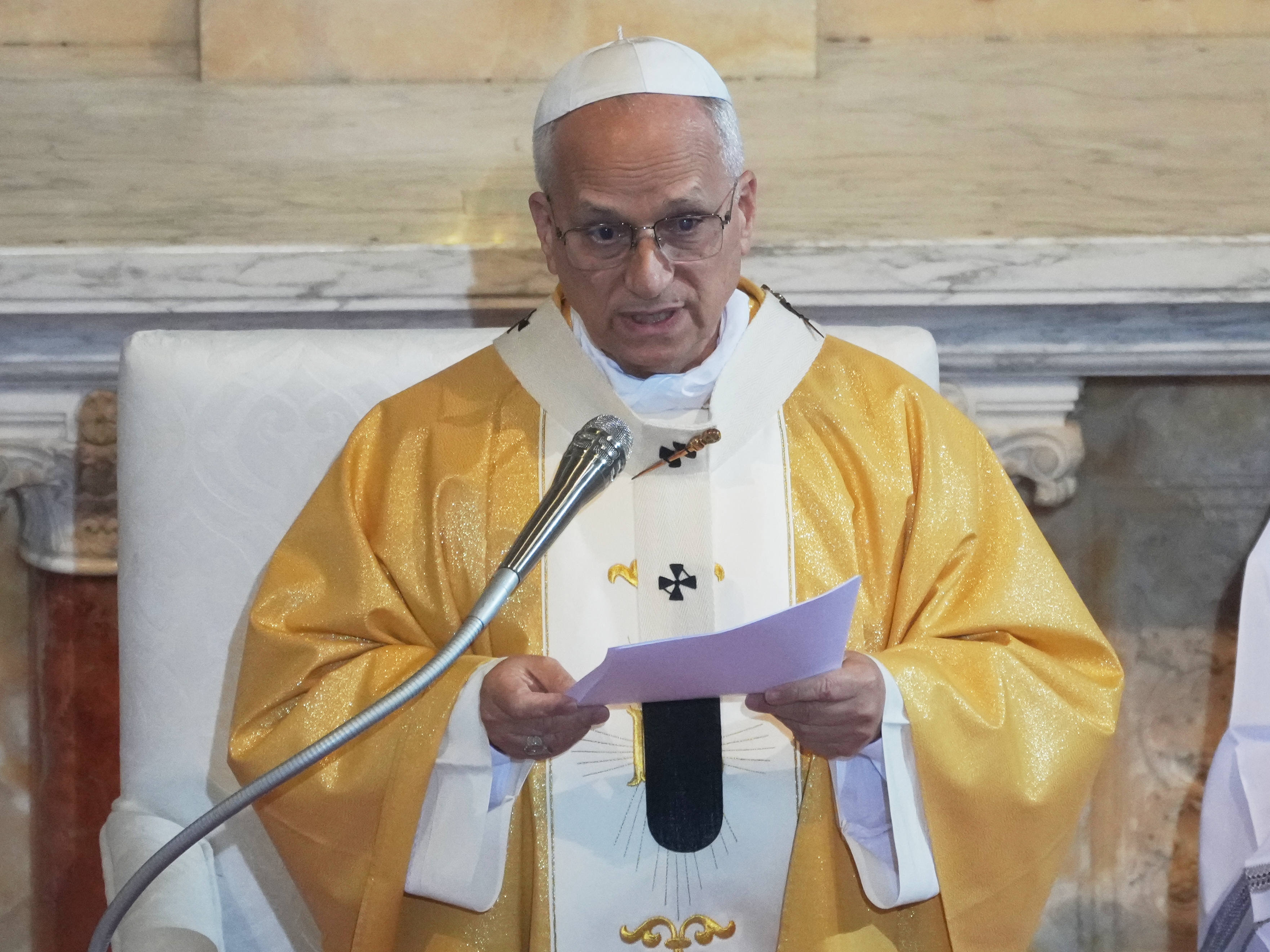 caption: Pope Leo XIV delivers his speech as he celebrates a Mass in the Saint Augustine Basilica in Annaba, Algeria, Tuesday, April 14, 2026, on the second day of an 11-day apostolic journey to Africa.