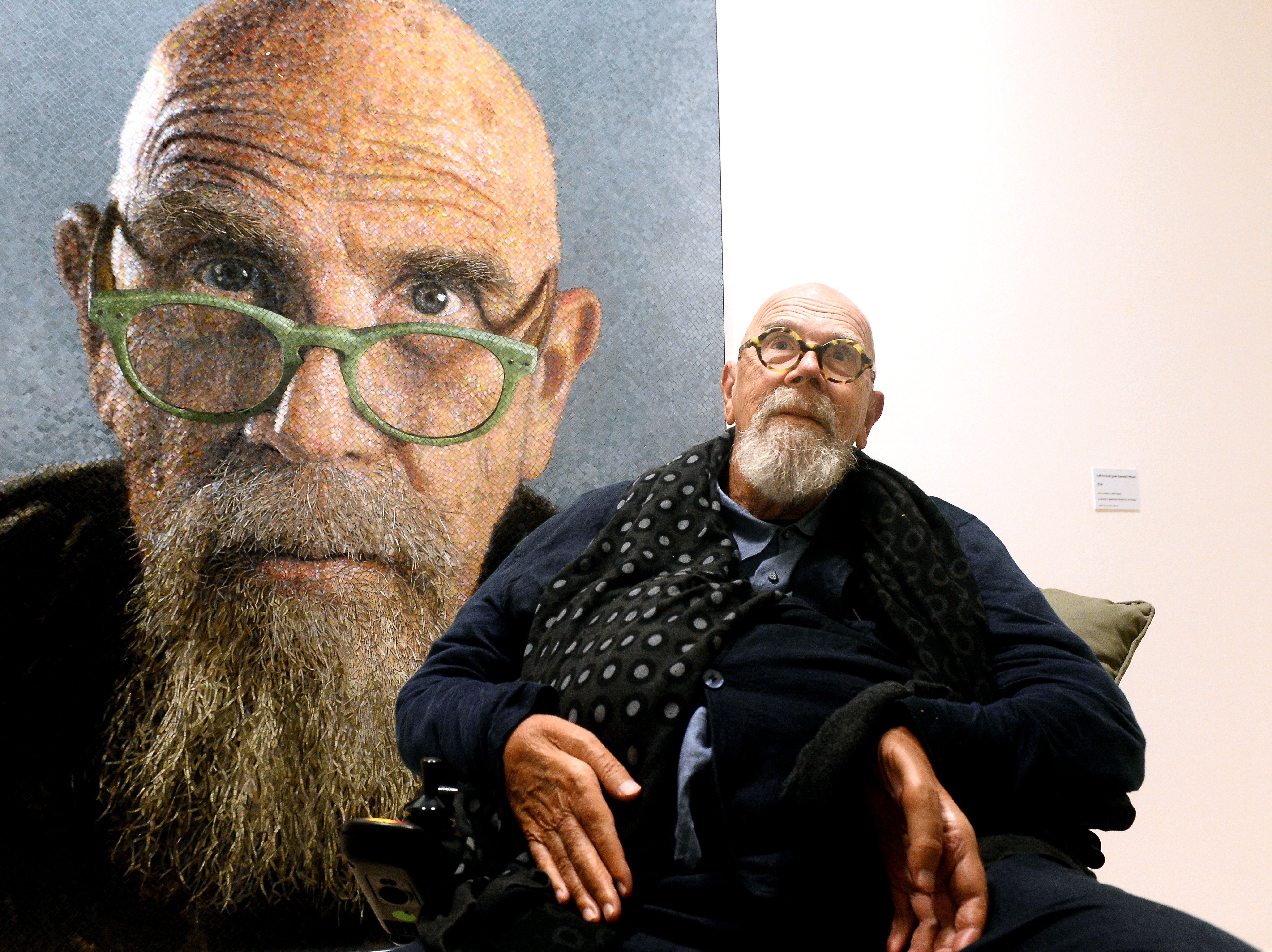 caption: Artist Chuck Close at a 2019 exhibition of his work in Ravenna, Italy.
