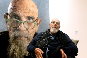 caption: Artist Chuck Close at a 2019 exhibition of his work in Ravenna, Italy.