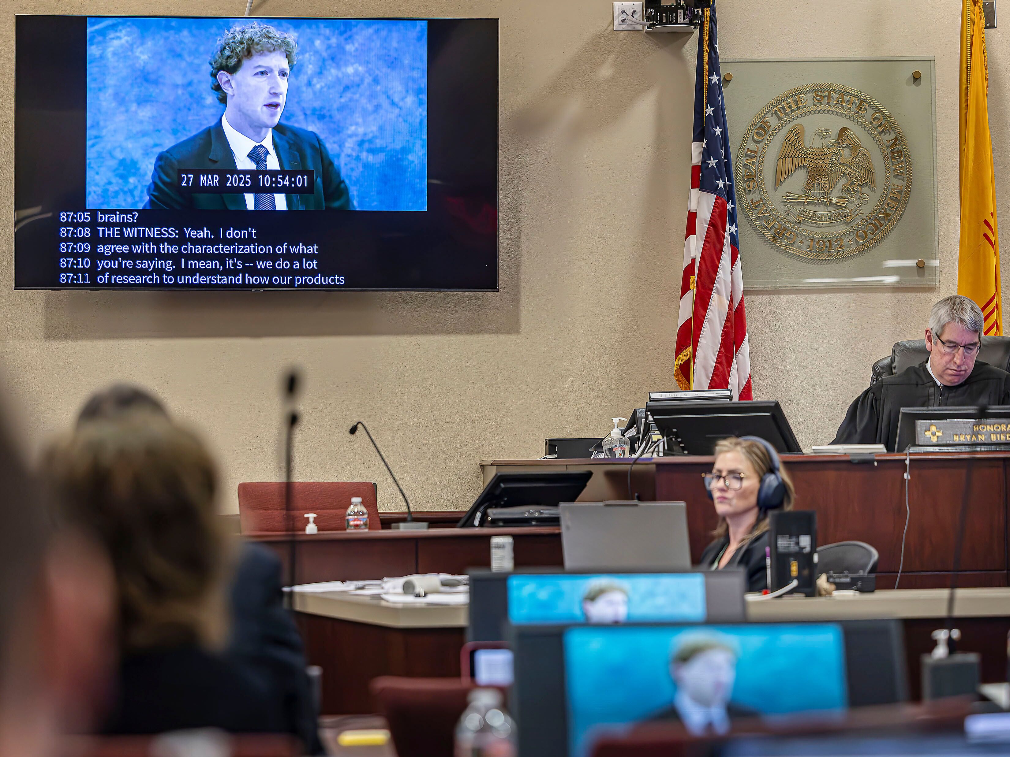 caption: A recording of Meta Founder and CEO Mark Zuckerberg's deposition is played for the jurors on March 4 in Santa Fe, N.M.