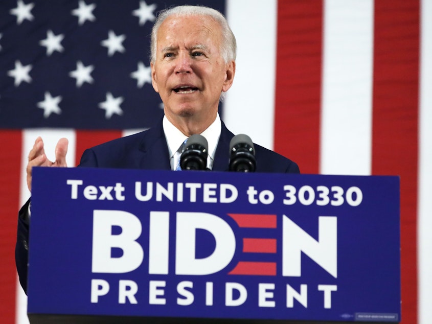 caption: Presumptive Democratic presidential nominee Joe Biden harshly criticized President Trump and his response to the coronavirus pandemic in remarks Tuesday at Alexis duPont High School in Wilmington, Del.