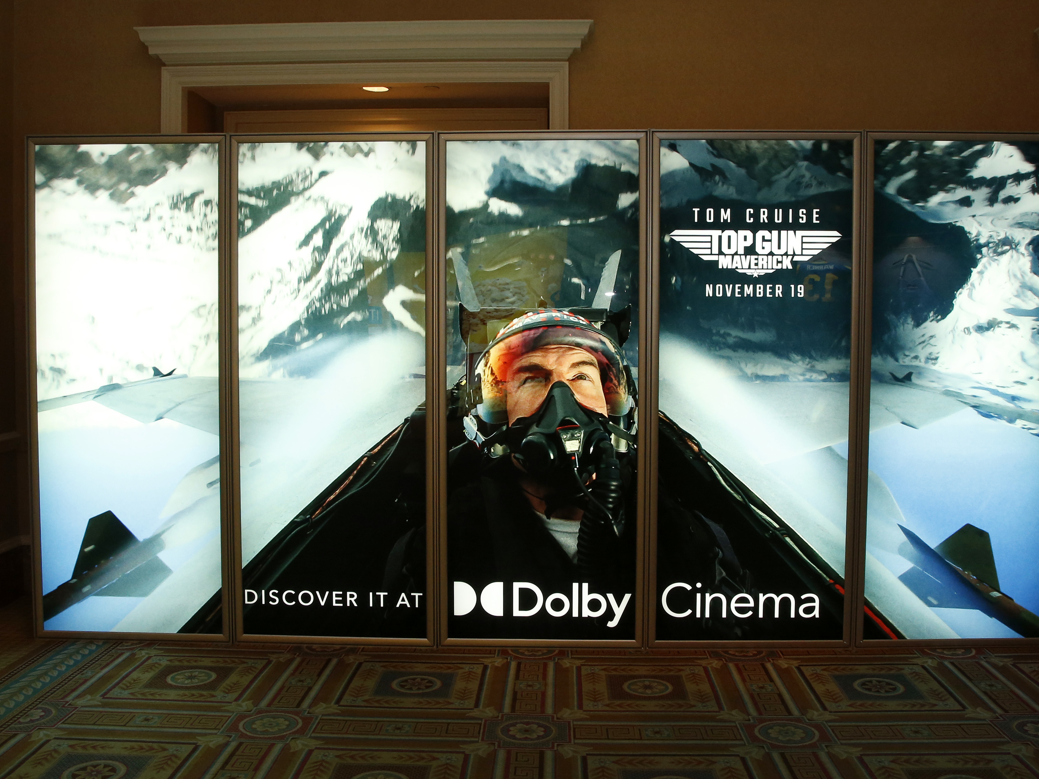 caption: An illuminated advertisement for the upcoming <em>Top Gun: Maverick</em> movie is displayed at Caesars Palace during CinemaCon, the official convention of the National Association of Theatre Owners, last month, in Las Vegas, Nevada.