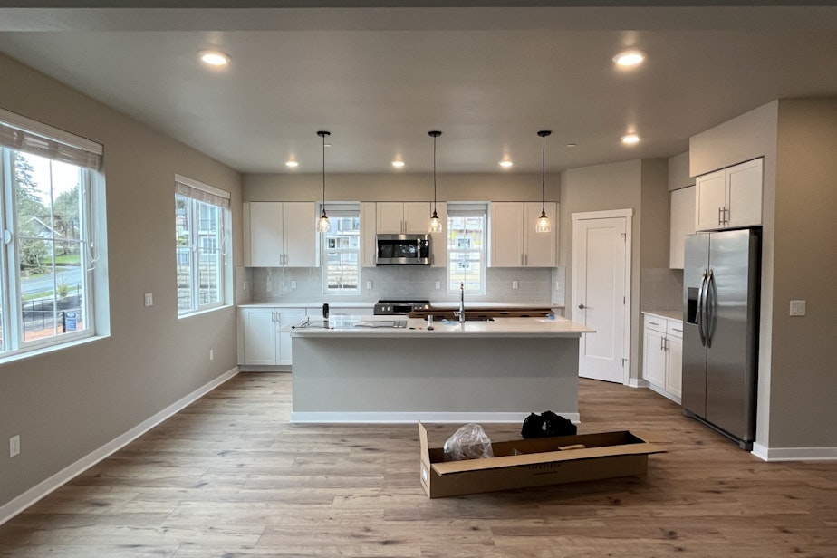 caption: A kitchen in a townhome in the Braes Park housing development in Edmonds