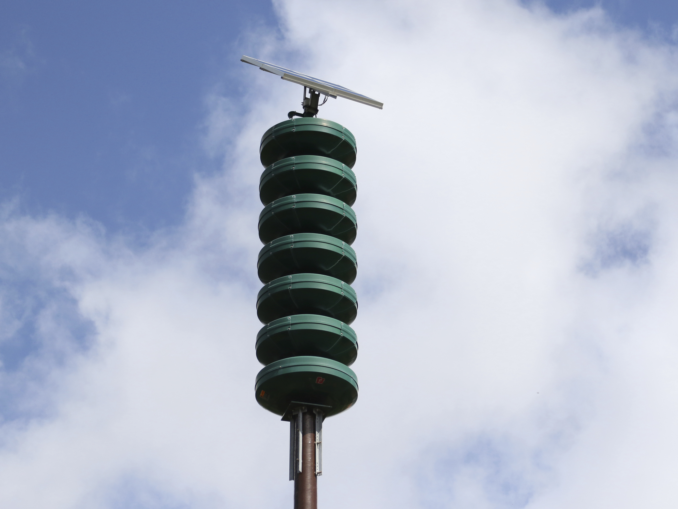 caption: A Hawaii Civil Defense Warning Device, which sounds an alert siren during natural disasters, is seen in Honolulu in a 2017 photograph.
