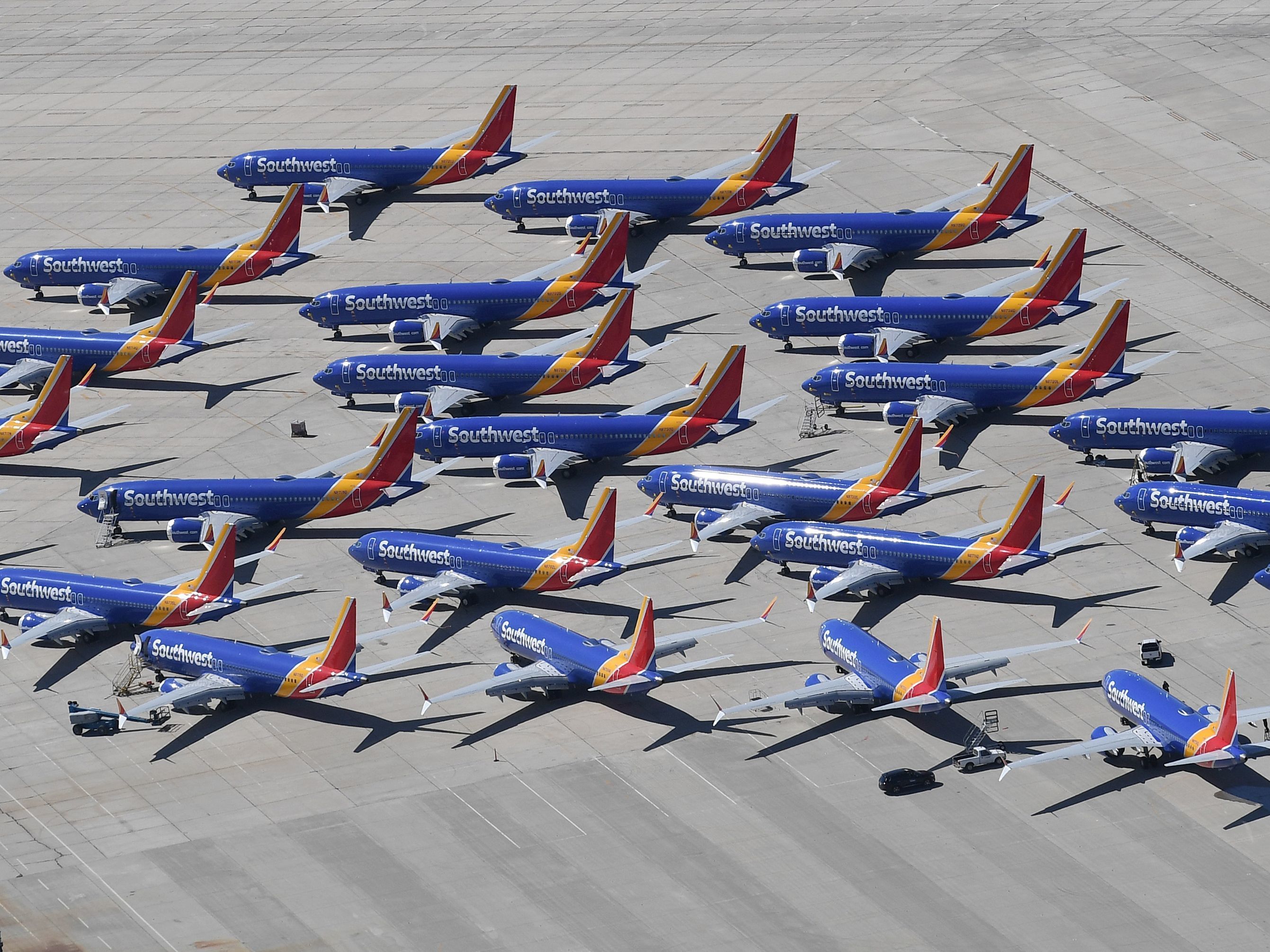 caption: All Boeing 737 Max aircraft are grounded while the manufacturer fixes a deadly defect in their flight control system. These Southwest Airlines planes were parked in Victorville, Calif., in March.