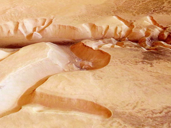 caption: In this handout image supplied by the European Space Agency on July 16, 2008, the Echus Chasma, one of the largest water source regions on Mars, is pictured from ESA's Mars Express.