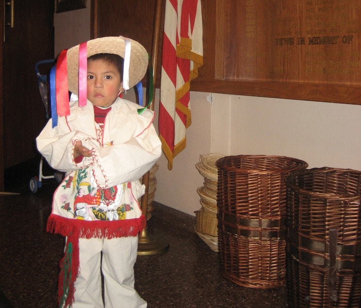 caption: Mexican boy dressed up for a community dance.