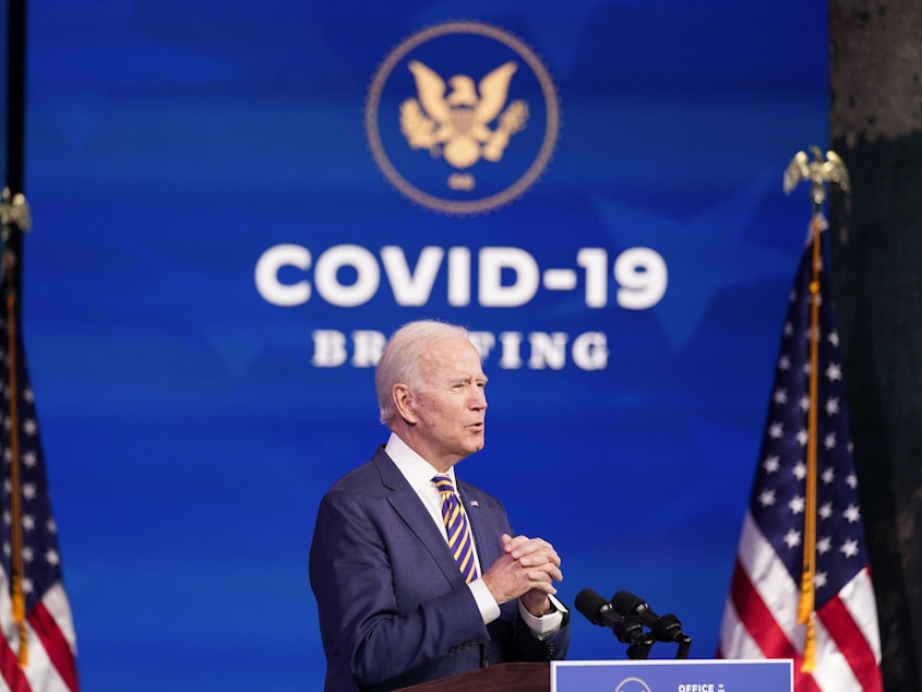 caption: President-elect Joe Biden speaks at The Queen theater, Tuesday, Dec. 29, 2020, in Wilmington, Del.