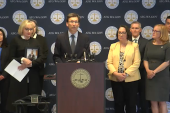 caption:  Attorney General Bob Ferguson announces an agreement with three major opioid distributors to settle a lawsuit that had gone to trial, but had not yet concluded. Under the agreement, the state and local governments will share a $476 million settlement to address the ongoing public health fallout from the opioid crisis. 