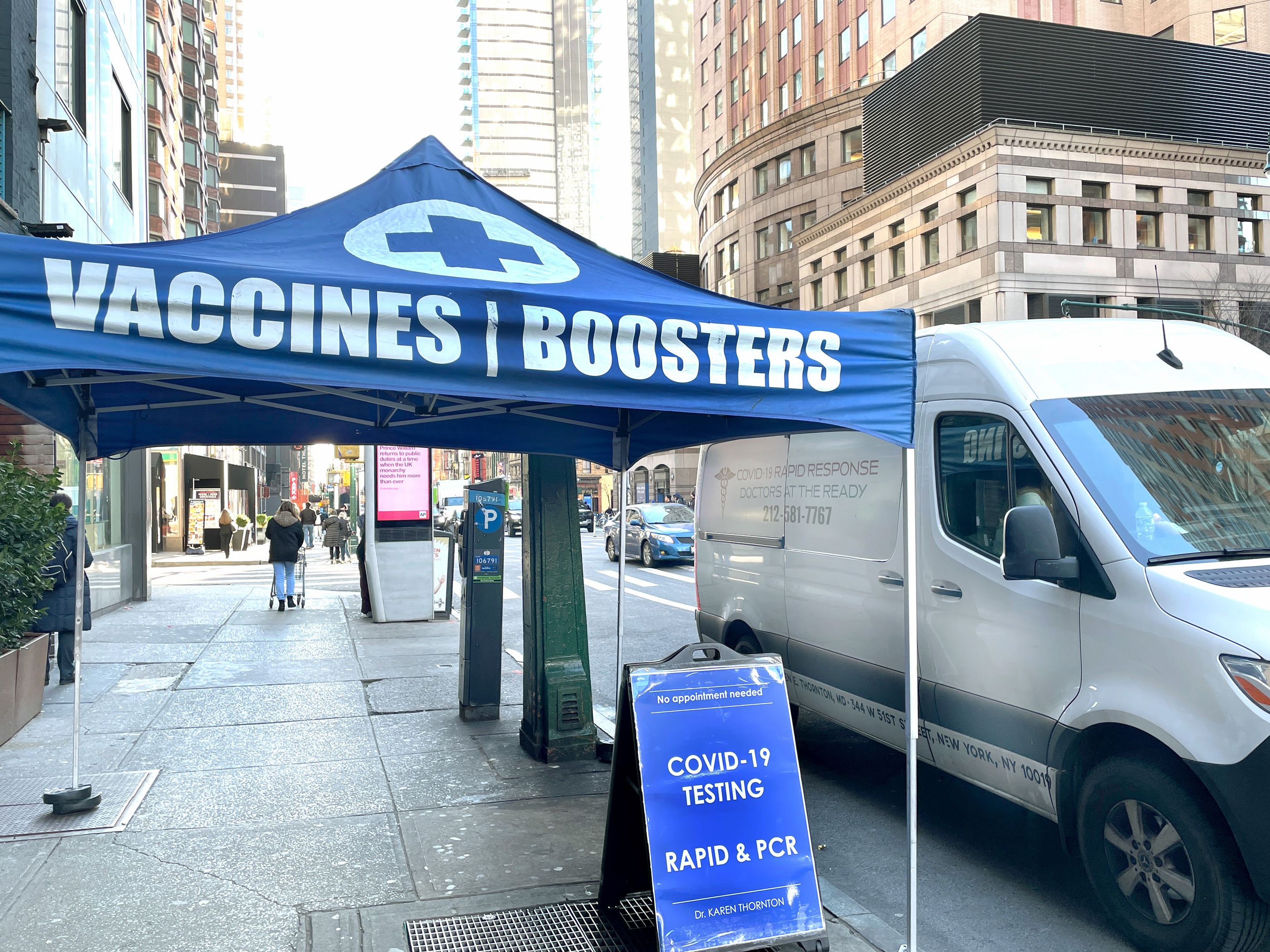 caption: A mobile medical station in New York City makes it convenient to get an updated COVID-19 vaccine. In the U.S., only 1 in 5 eligible individuals has rolled up their sleeve for this latest vaccine version.