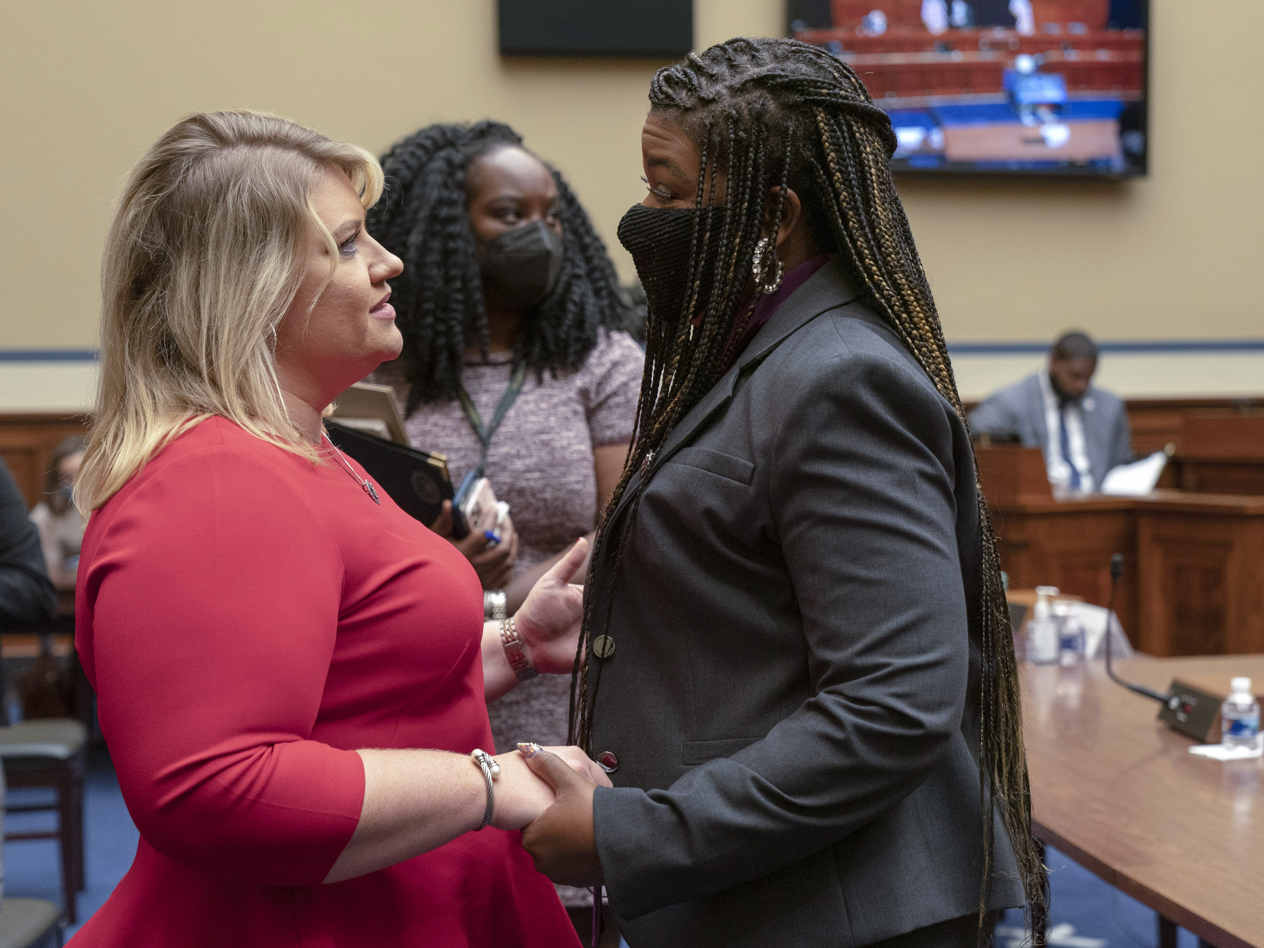 caption: After the hearing, Rep. Cori Bush and Rep. Kat Cammack, each with a drastically different opinion on abortion rights, embraced.