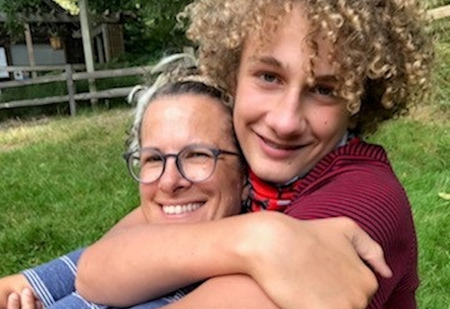 caption: Queen Anne resident Moffett Burgess is hugged by her son Gibbs. 

From Burgess: "My son is a teenager now, so these moments of affection are particularly rare and precious." 