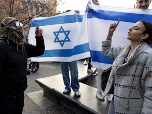 caption: Pro-Palestinian and pro-Israeli supporters converge at a demonstration of New York University students in November.