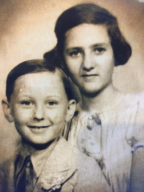 caption: A young Werner Glass and his sister Helga pose for a portrait.