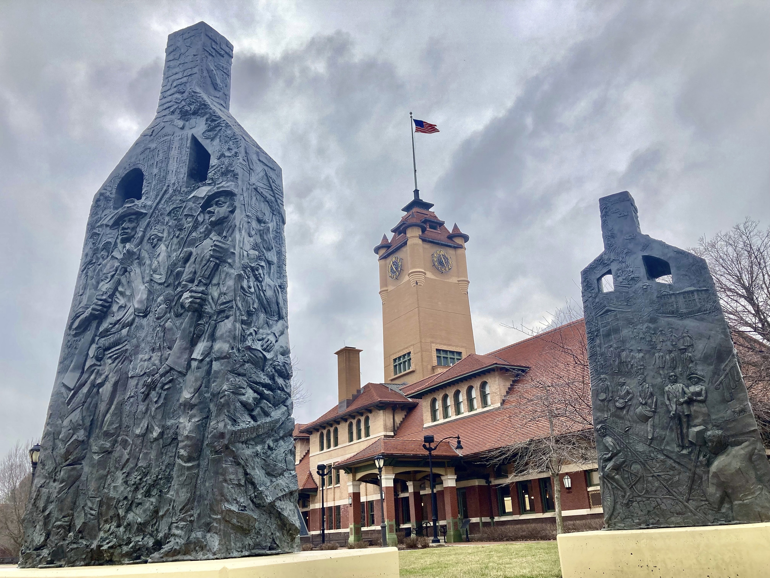 caption: Sculptures representing charred chimneys rising from the smoldering rubble of burned-out buildings make up the centennial memorial of the 1908 race riot, entitled <em>Acts of Intolerance</em> by Preston Jackson, on March 22, 2023, in Springfield, Ill. 