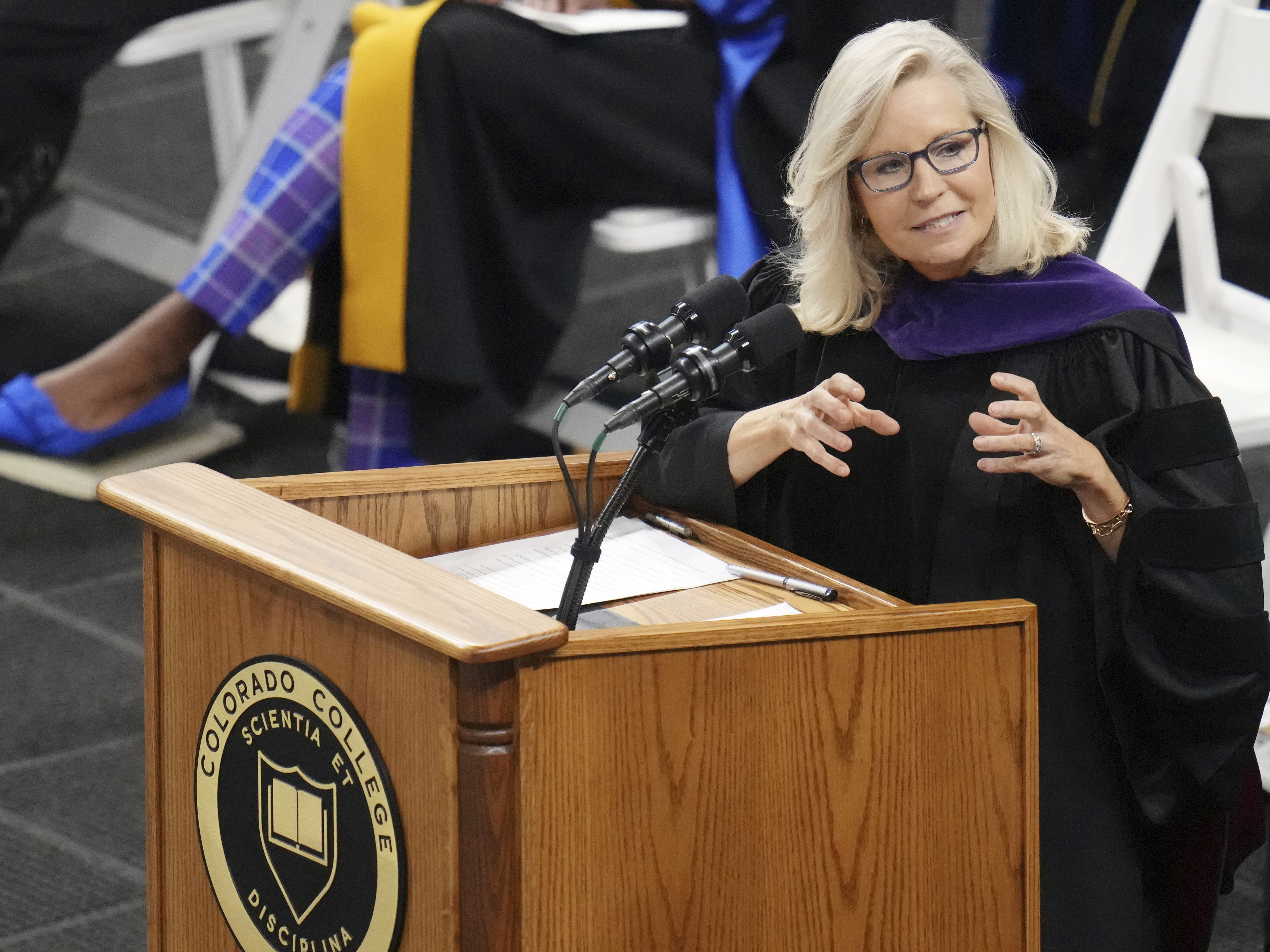 caption: Former U.S. Rep. Liz Cheney, R-Wyo., delivers the commencement address at Colorado College on Sunday in Colorado Springs, Colo. She urged the 2023 graduates to not compromise on the truth.
