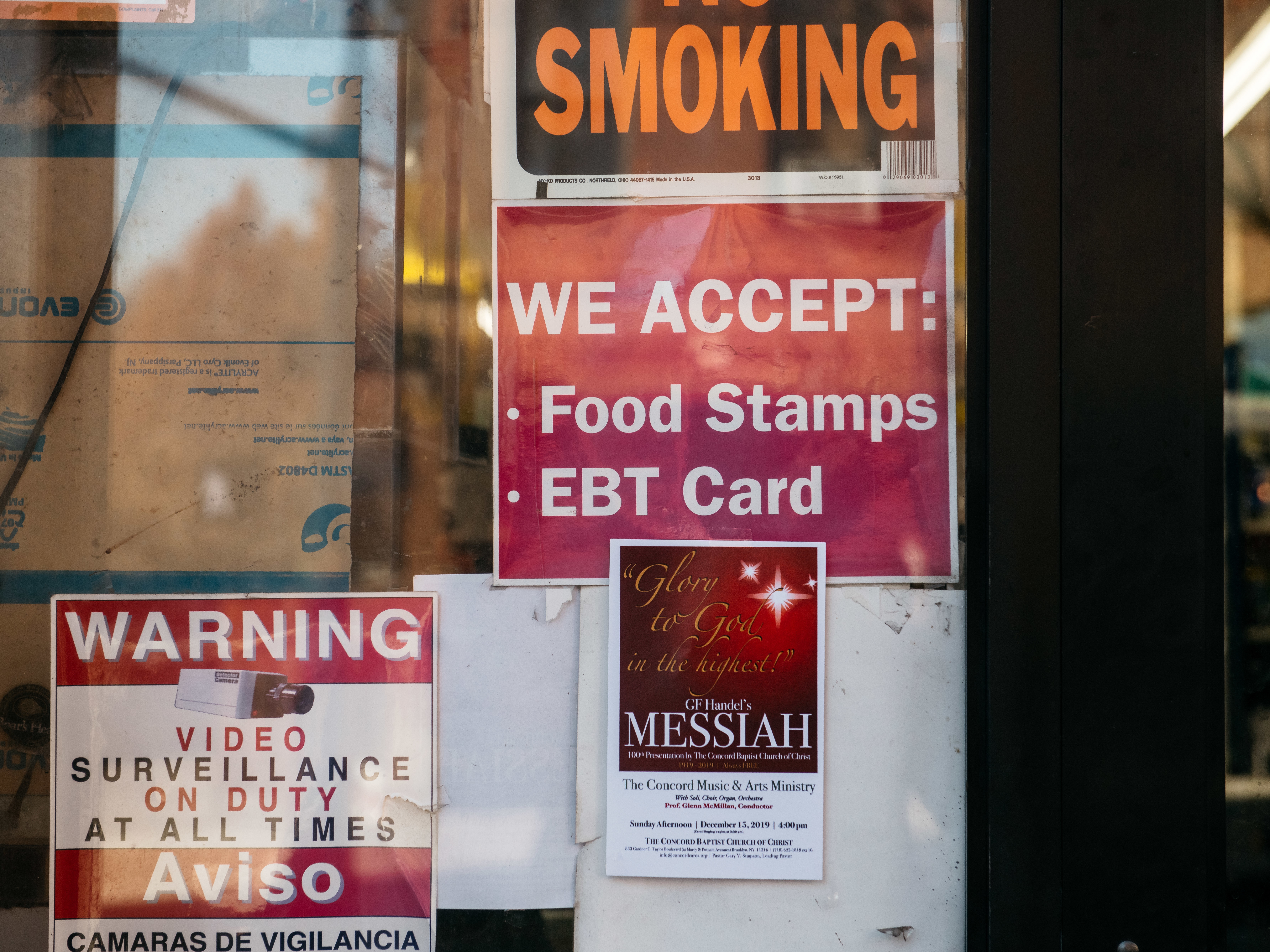 caption: A sign alerts customers about SNAP food stamp benefits at a grocery store in New York City in December 2019. Benefits from the Supplemental Nutrition Assistance Program are getting a historic boost nearly two years later under the Biden administration.