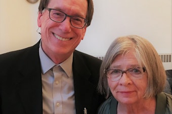 caption: KUOW's Ross Reynolds and Barbara Ehrenreich at Seattle First Baptist Church