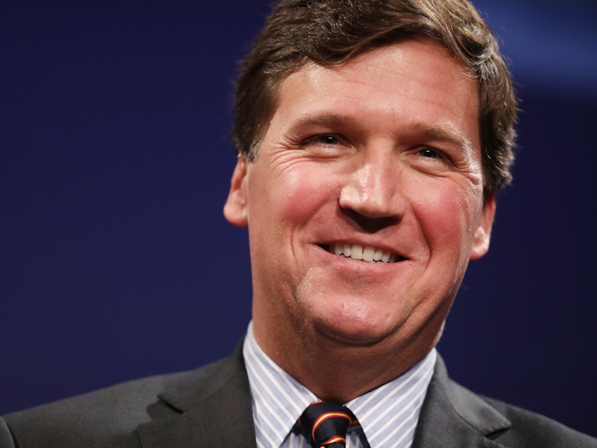 caption: Fox News host Tucker Carlson "is not 'stating actual facts' about the topics he discusses and is instead engaging in 'exaggeration' and 'non-literal commentary,'" wrote U.S. District Judge Mary Kay Vyskocil.