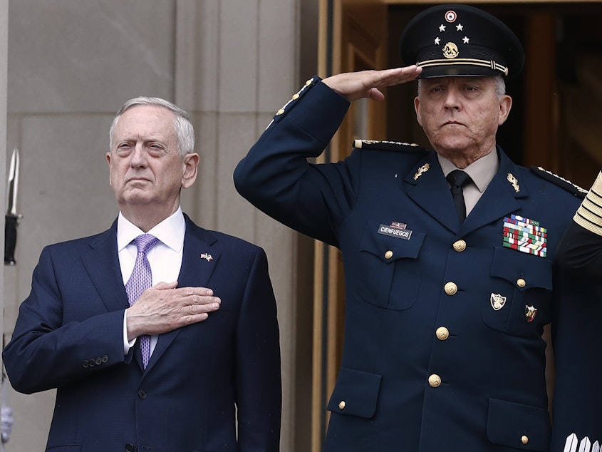 caption: Former Defense Secretary Jim Mattis, left, and former Mexican Defense Secretary Gen. Salvador Cienfuegos Zepeda during an honor cordon at the Pentagon in 2017. Mexico cleared Cienfuegos of all charges related to drug trafficking on Thursday.