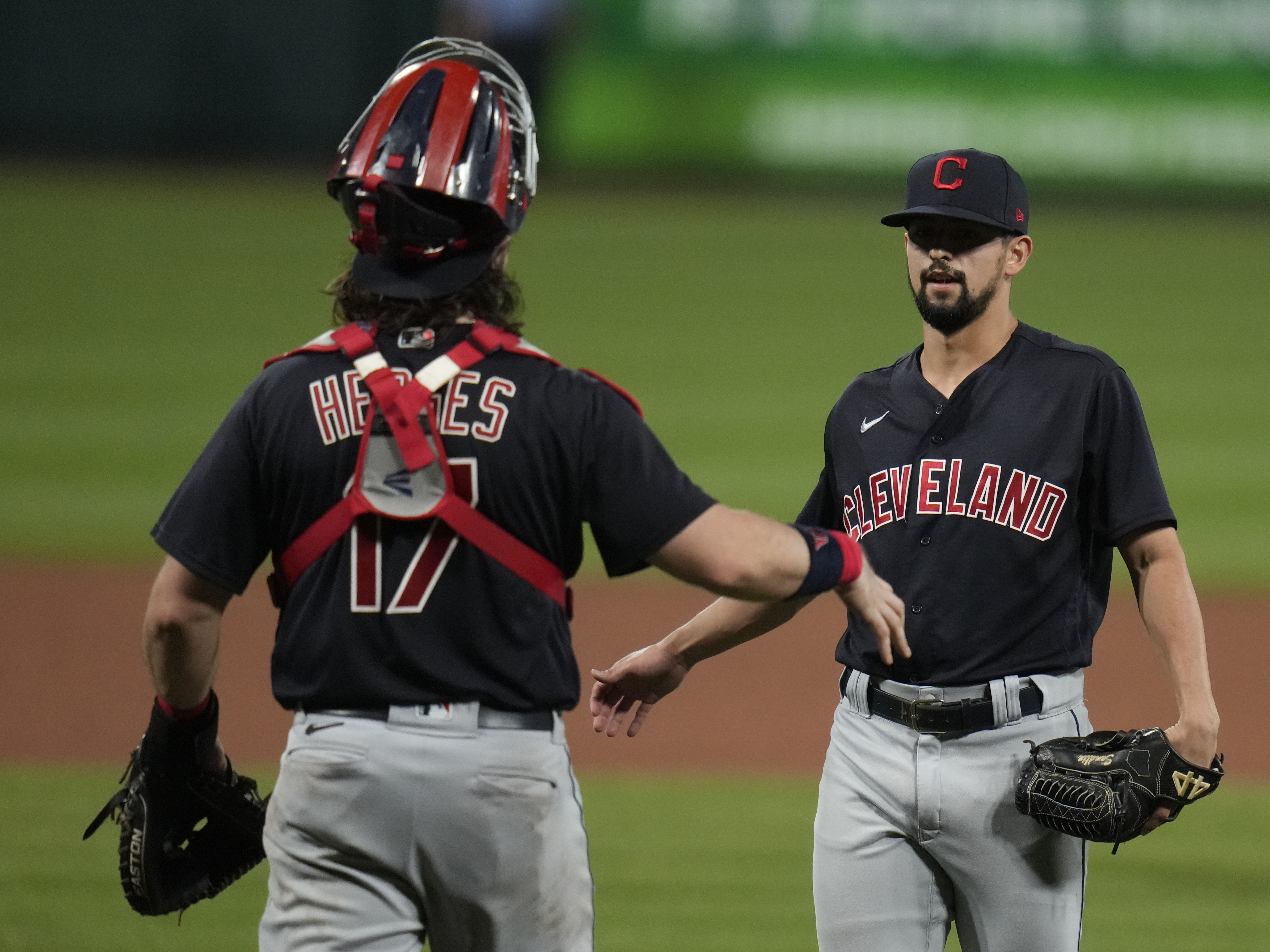 caption: Cleveland relief pitcher Nick Sandlin (right) and catcher Austin Hedges celebrate a 10-1 victory over the St. Louis Cardinals on June 8. On Friday, the Cleveland team announced its new name, the Guardians.