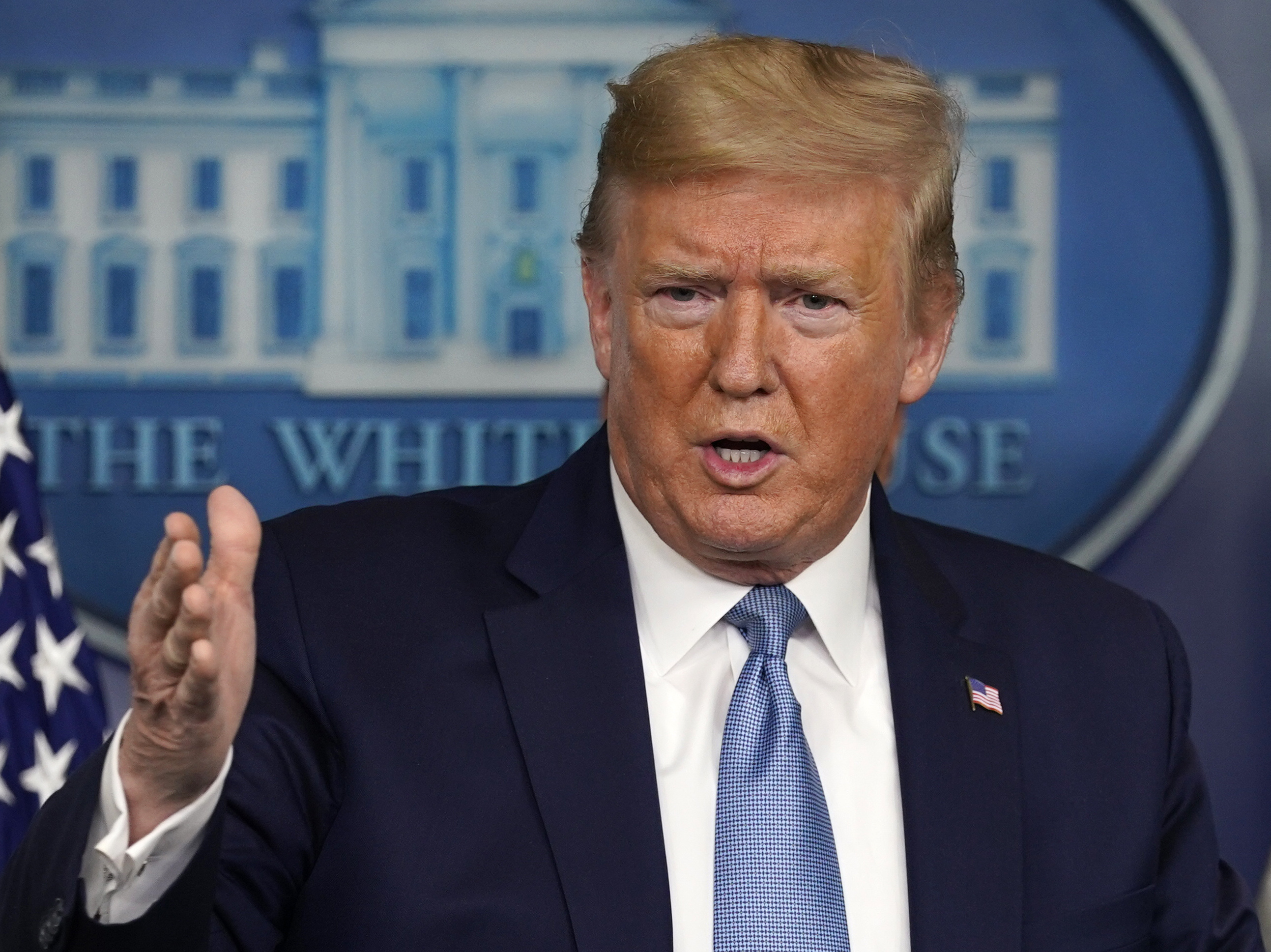 caption: President Donald Trump speaks during a press briefing with the coronavirus task force, in the Brady press briefing room at the White House on Monday.