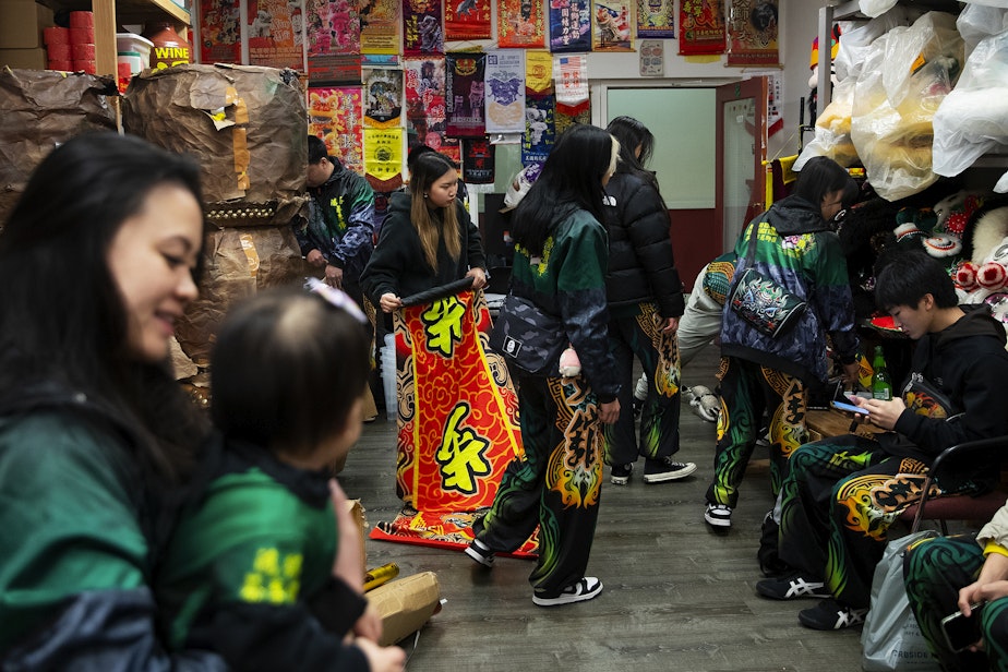 caption: Mak Fai Dragon and Lion dancers get ready for several performances ahead of the Lunar New Year celebration on Saturday, Feb. 4, 2023, in Seattle’s Chinatown-International District. 