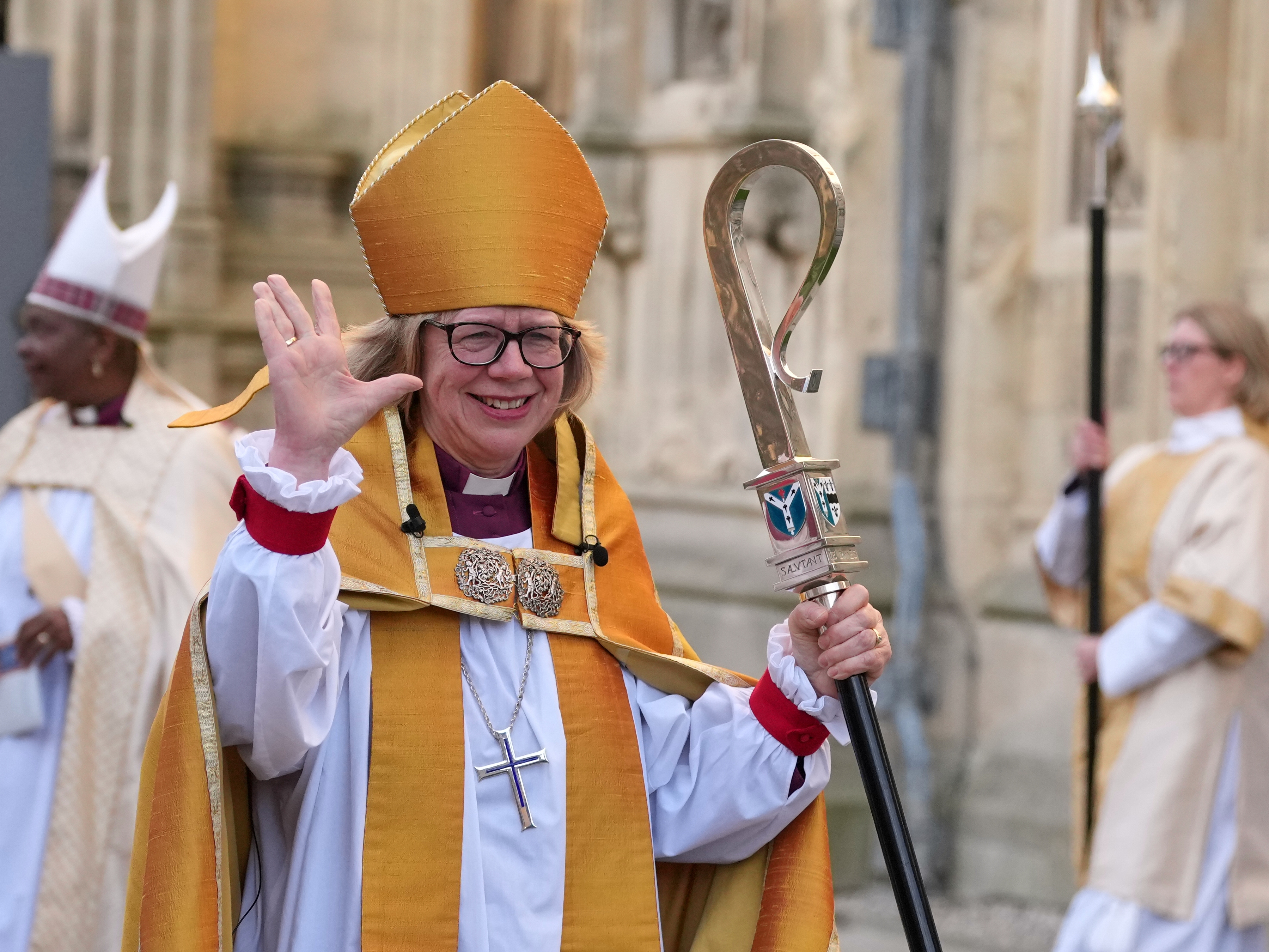 caption: Sarah Mullally waves as she leaves after the Enthronement Ceremony installing her as archbishop of Canterbury in Canterbury, England on Wednesday, March 25, 2026. She is the first woman ever to lead the Church of England.