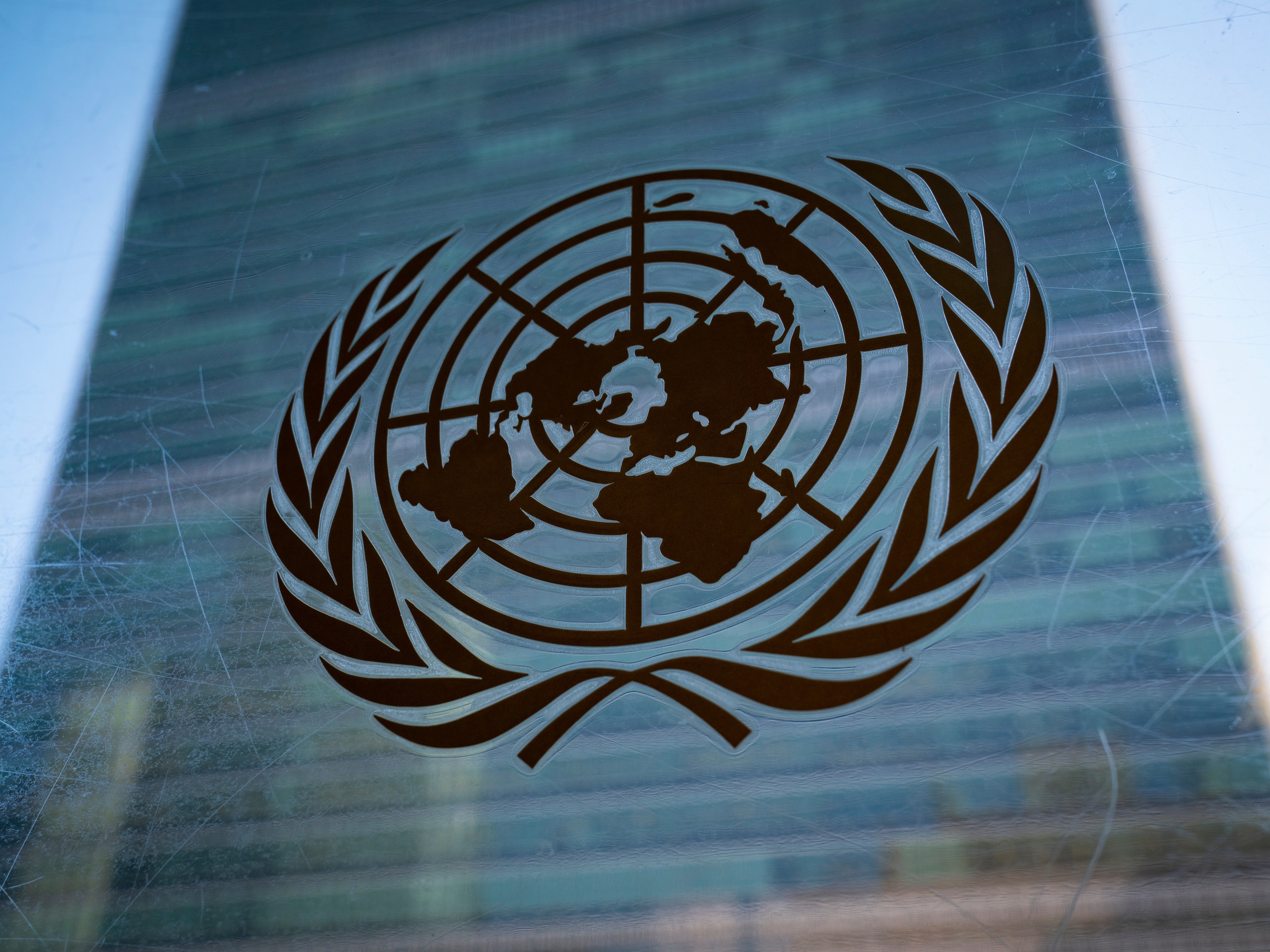 caption: The symbol of the United Nations is displayed outside the Secretariat Building on Feb. 28, 2022, at United Nations Headquarters.