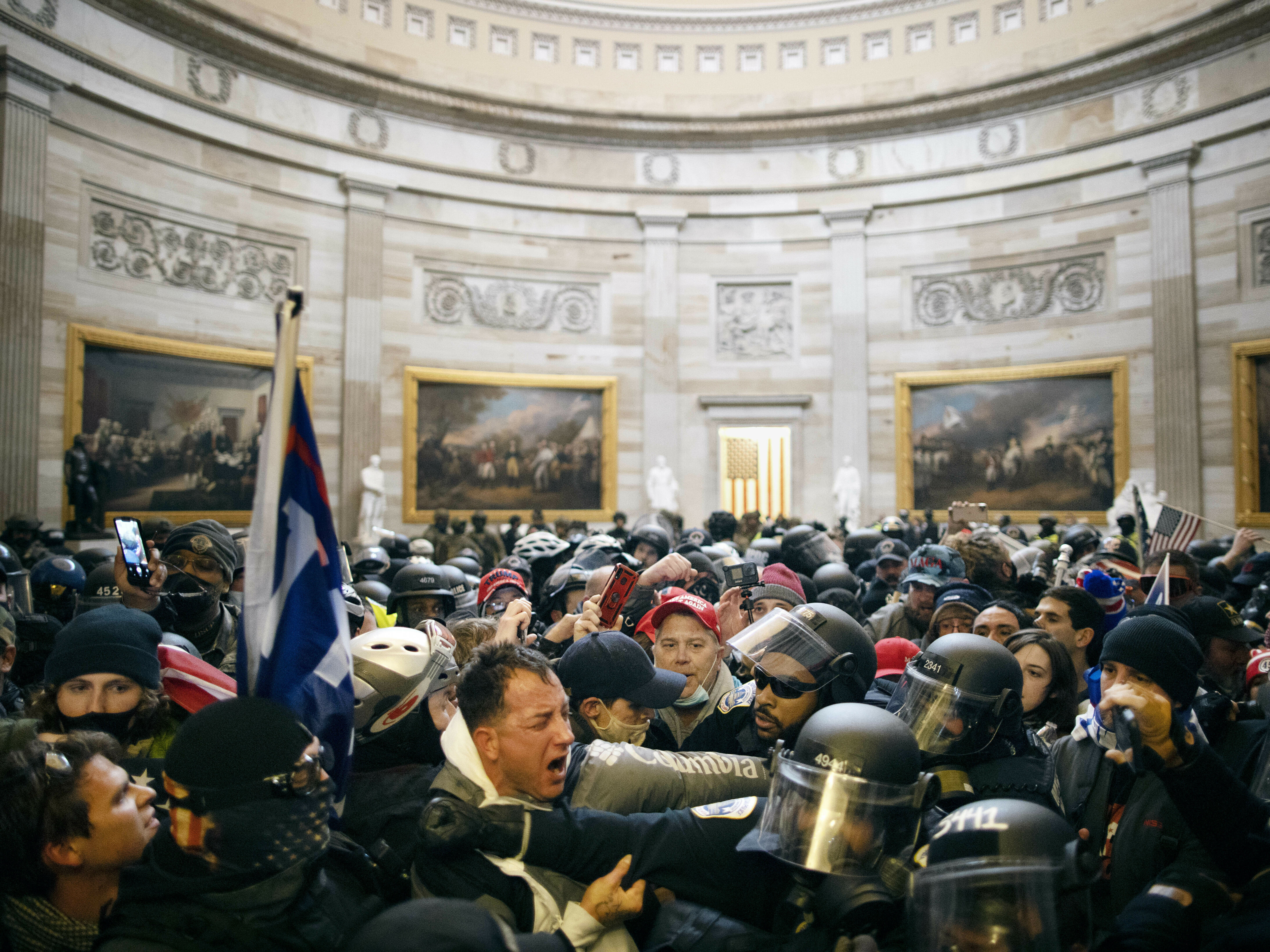 caption: Police clash with supporters of President Donald Trump who breached security and entered the Capitol building in Washington D.C., on Jan. 6, 2021.