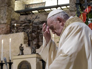 caption: Pope Francis celebrates Mass in the crypt of the Basilica of St. Francis, in Assisi, Italy, on Oct. 3.